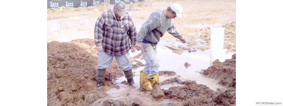 Excavation crew attempting to pump water.